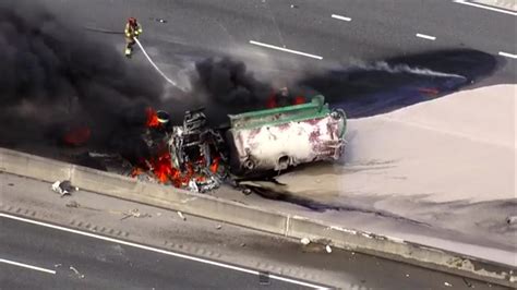 All lanes blocked on I-595 West near Nob Hill Road in Davie after tanker rolls over, catches on fire;